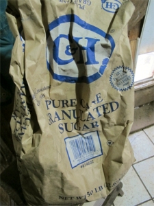 Well used 50 pound bag of cane sugar